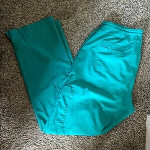 Med couture amp women’s scrub pants with 6 pockets.